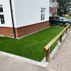 Synthetic grass to property side and rear