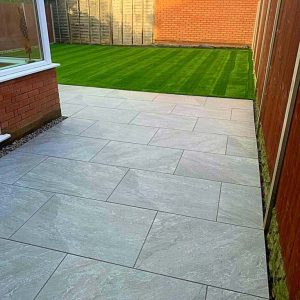 Patio leading to artificial lawn