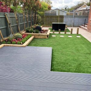 Artificial lawn and decking area in back garden